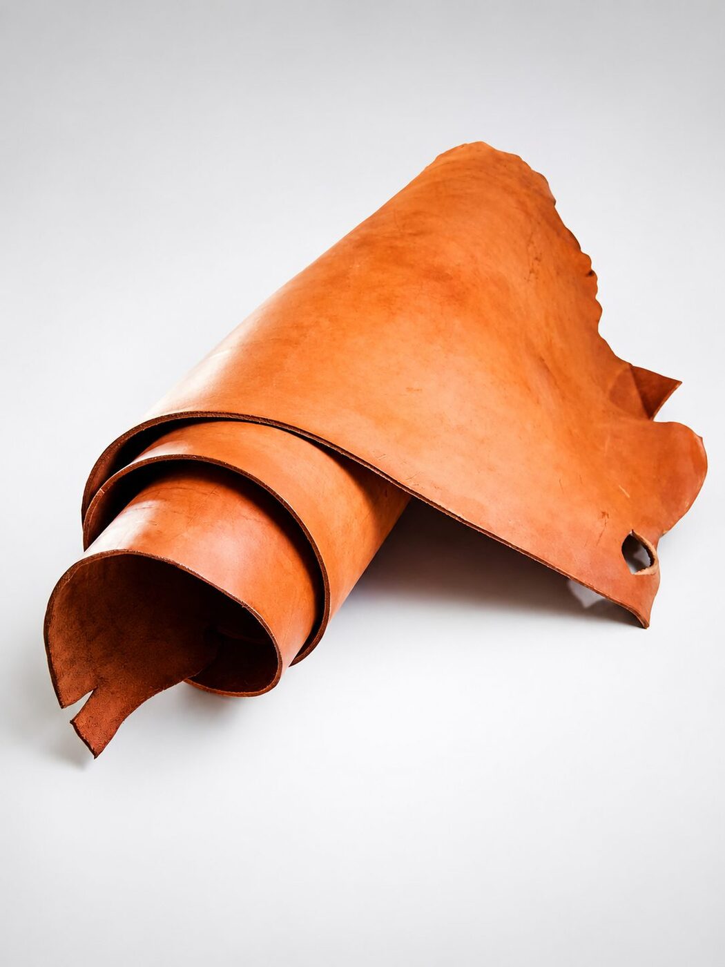 Rolled russet vegetable-tanned leather side